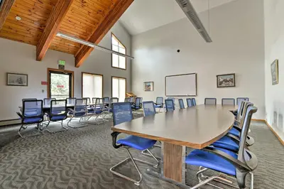 a conference room with a long table and chairs at Mtn-View Gem with Community Perks in Silverthorne! in Silverthorne