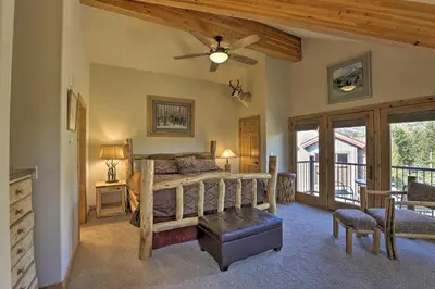 a bedroom with a bed and a ceiling fan at 7 Mi to Copper Mtn Condo with Deck and Stunning Views in Frisco