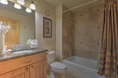 a bathroom with a toilet and a tub and a sink at 7 Mi to Copper Mtn Condo with Deck and Stunning Views in Frisco