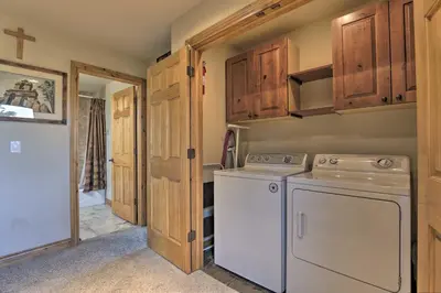 a laundry room with a washer and dryer at 7 Mi to Copper Mtn Condo with Deck and Stunning Views in Frisco