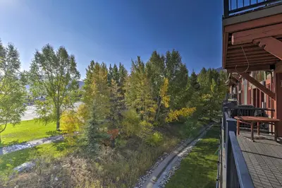 a balcony of a building with a view of trees at 7 Mi to Copper Mtn Condo with Deck and Stunning Views in Frisco