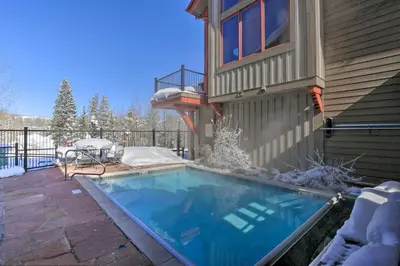 a swimming pool on the side of a house at 7 Mi to Copper Mtn Condo with Deck and Stunning Views in Frisco