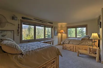 a bedroom with two beds and a window at 7 Mi to Copper Mtn Condo with Deck and Stunning Views in Frisco