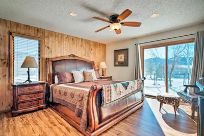 a bedroom with a bed and a ceiling fan at 7 Mi to Rocky Mtn NP Updated Estes Park Home in Estes Park