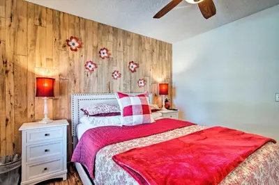 a bedroom with a bed and two night stands and two lamps at 7 Mi to Rocky Mtn NP Updated Estes Park Home in Estes Park
