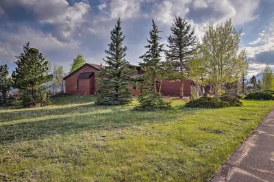 an old red house in a field with trees at 7 Mi to Rocky Mtn NP Updated Estes Park Home in Estes Park