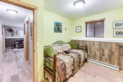 a bedroom with a bed in a room at Balcony, Fire Pit and Grill Grand Lake Retreat! in Grand Lake
