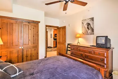 a bedroom with a bed and a tv on a dresser at 4 Mi to Breckenridge Resort Condo with Sauna Access in Breckenridge