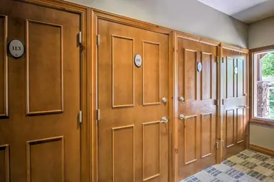 a row of wooden lockers in a room at 4 Mi to Breckenridge Resort Condo with Sauna Access in Breckenridge