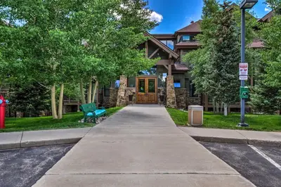 a house with a walkway leading to the front door at 4 Mi to Breckenridge Resort Condo with Sauna Access in Breckenridge