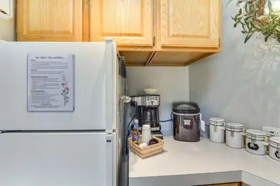 a kitchen with a refrigerator and a coffee maker at Cabin on Clear Creek A Hobbits Retreat! in Black Hawk
