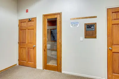 a room with two wooden doors in a room at Relax in our hot tub after world class skiing in Silverthorne