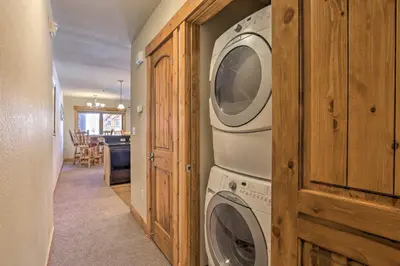 a laundry room with a washer and dryer at Peaceful Fraser Condo with Patio - by Hiking Trails! in Fraser