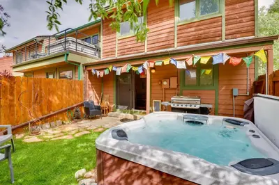 a hot tub in the yard of a house at 2 Mi to Frisco Ski Hill Mountain Home with Hot Tub! in Frisco