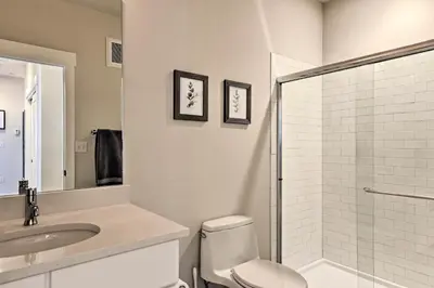 a bathroom with a toilet and a sink and a shower at Downtown Winter Park Condo - 3 Miles to Ski Resort in Winter Park