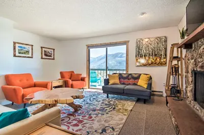 a living room with a couch and chairs and a fireplace at Grand Lake Condo Best Lake View and Panoramic Deck in Grand Lake