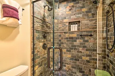 a bathroom with a shower with a glass door at Grand Lake Condo Best Lake View and Panoramic Deck in Grand Lake