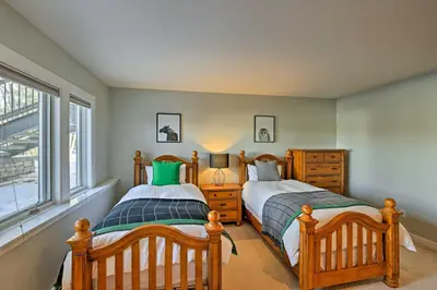 a bedroom with two beds and a window at Gorgeous Townhome with Fraser Valley Mountain Views! in Fraser