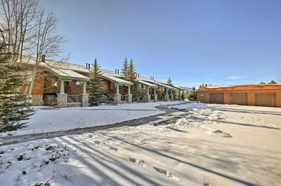 a snow covered street with a row of houses at Gorgeous Townhome with Fraser Valley Mountain Views! in Fraser