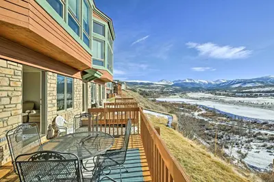 a balcony with chairs and tables on a house at Gorgeous Townhome with Fraser Valley Mountain Views! in Fraser