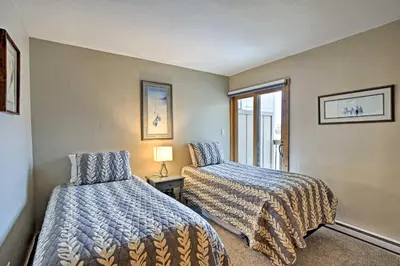 a bedroom with two beds and a window at Mtn-View Condo with Hot Tub Access in Dillon! in Dillon