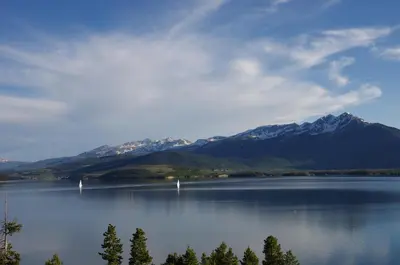 a view of a lake with mountains in the background at Mtn-View Condo with Hot Tub Access in Dillon! in Dillon