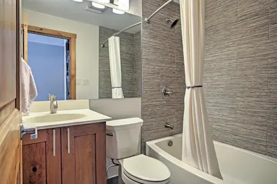 a bathroom with a toilet and a sink and a shower at Mtn-View Condo with Hot Tub Access in Dillon! in Dillon