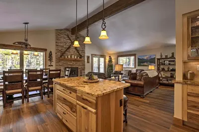 a kitchen and living room with a table and chairs at Hot Tub! Family Gem on Snake River in Keystone! in Keystone