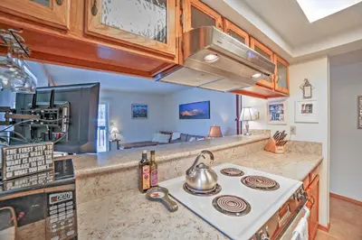 a kitchen with a stove with a tea kettle on it at Walk to Main St Condo with Deck in Frisco in Frisco