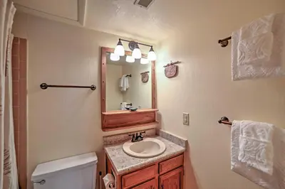 a bathroom with a sink and a mirror at Walk to Main St Condo with Deck in Frisco in Frisco