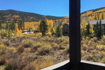 a view from a window of a house in the mountains at Walk to Main St Condo with Deck in Frisco in Frisco