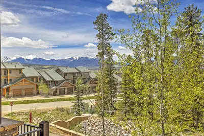a view of a residential neighborhood with mountains in the background at Lavish Fraser Townhome with Deck and Mountain Views! in Fraser