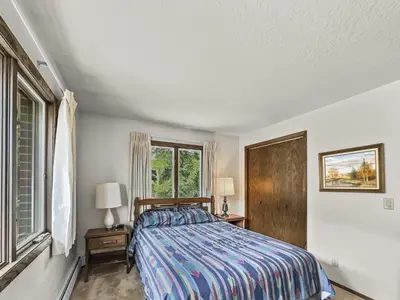 a bedroom with a bed and a window at CC43 Chateau Claire condo in Dillon