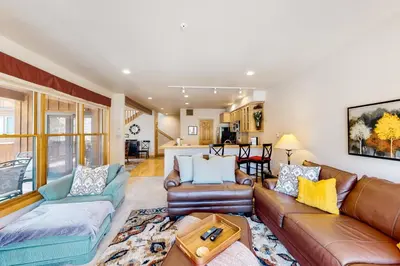 a living room with a couch and a table at Mill Creek #203 in Keystone