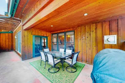 a dining room with a table and chairs at Mill Creek #203 in Keystone
