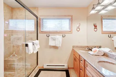 a bathroom with a shower and a sink at Ski Run Condominiums #108 in Keystone