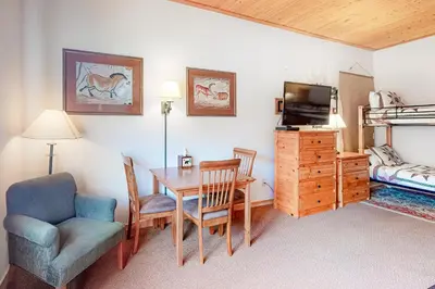 a room with a dining room table and a bedroom at Gateway #5055 in Keystone