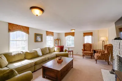 a living room with a couch and a coffee table at Empire Vacation Rental with Fire Pit and Gas Grill! in Empire