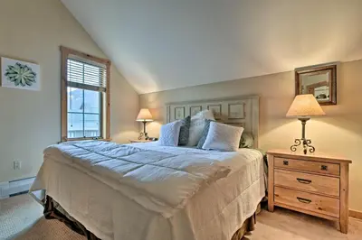 a bedroom with a large bed and a window at Keystone Ski Condo with Mtn View - Walk to Gondola! in Keystone