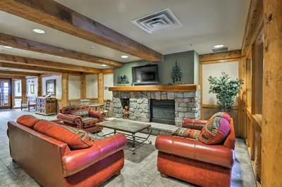 a living room with leather furniture and a fireplace at Keystone Ski Condo with Mtn View - Walk to Gondola! in Keystone