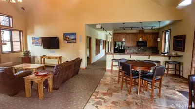 a living room with a couch and a table at Trailhead Lodge One Bedroom 801 condo in Winter Park