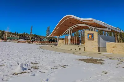 a building with a roof in the snow at Trailhead Lodge One Bedroom 801 condo in Winter Park