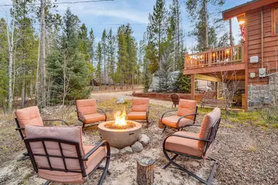 a group of chairs sitting around a fire pit at 2 Mi to Rocky Mountain Natl Park Cabin with Views in Grand Lake