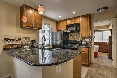 a kitchen with a sink and a counter top at Greenwood Village Condo with Pool Access! in Greenwood Village