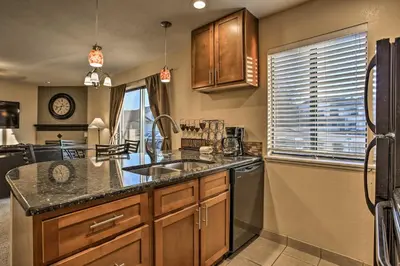a kitchen with a sink and a dishwasher at Greenwood Village Condo with Pool Access! in Greenwood Village