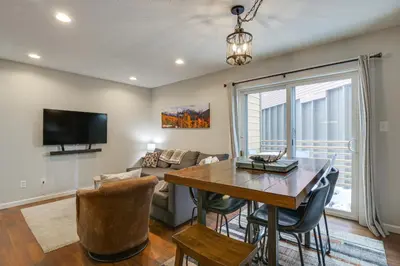 a living room with a table and a couch at Updated Townhome Near Main Street, 10 Mi to Breck! in Frisco