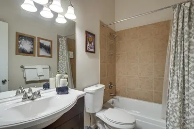 a bathroom with a sink and a toilet and a tub at Updated Townhome Near Main Street, 10 Mi to Breck! in Frisco