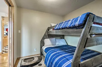 a bedroom with two bunk beds in a room at Arvada Home with Beautifully Landscaped Yard! in Arvada