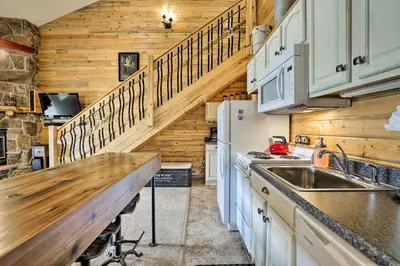 a kitchen with a sink and a counter top at Granby Condo with Pool Access, Near Hiking and Skiing! in Granby