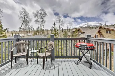 a patio with two chairs and a grill on a deck at 10 Mi to Ski Condo with Mtn Views in Silverthorne in Silverthorne